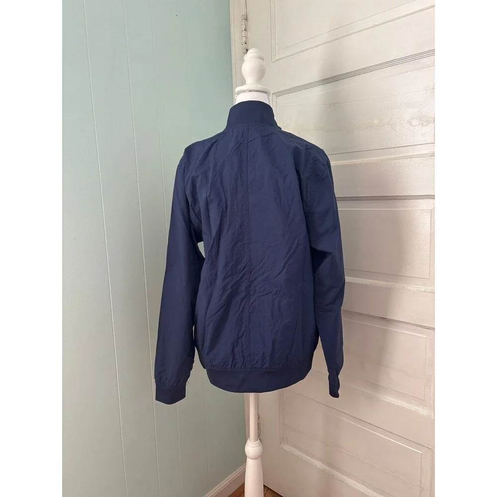 Women's Nike windbreaker rain jacket navy blue pockets Athletic sportswear NWOT